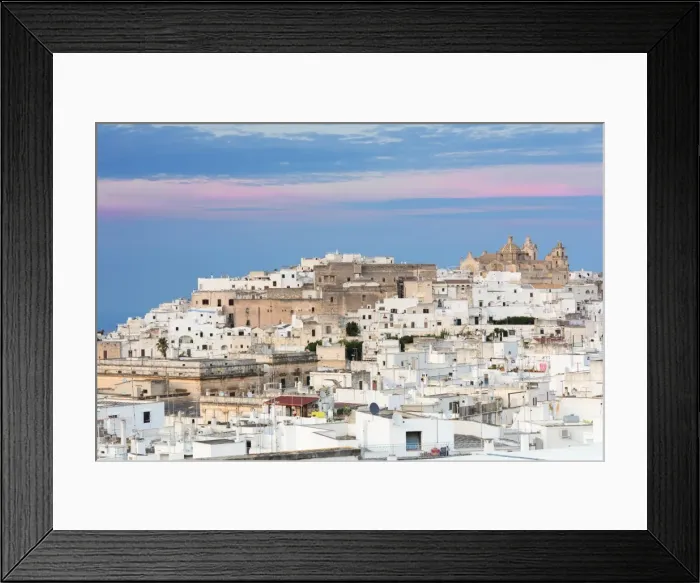 Framed Print : View of typical architecture and white houses of the old medieval town at sunset Framed Print : View of typical architecture and white houses of the old medieval town at sunset