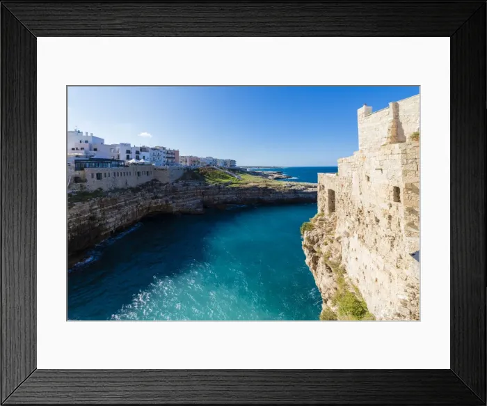 Framed Print : Turquoise sea framed by the old town perched on the rocks, Polignano a Mare, Province of Bari Framed Print : Turquoise sea framed by the old town perched on the rocks, Polignano a Mare, Province of Bari