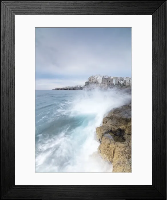 Framed Print : Waves of turquoise sea crashing on cliffs framed by the old town, Polignano a Mare Framed Print : Waves of turquoise sea crashing on cliffs framed by the old town, Polignano a Mare