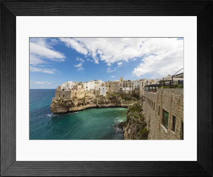 Framed Print : Turquoise sea framed by the old town perched on the rocks, Polignano a Mare, Province of Bari Framed Print : Turquoise sea framed by the old town perched on the rocks, Polignano a Mare, Province of Bari