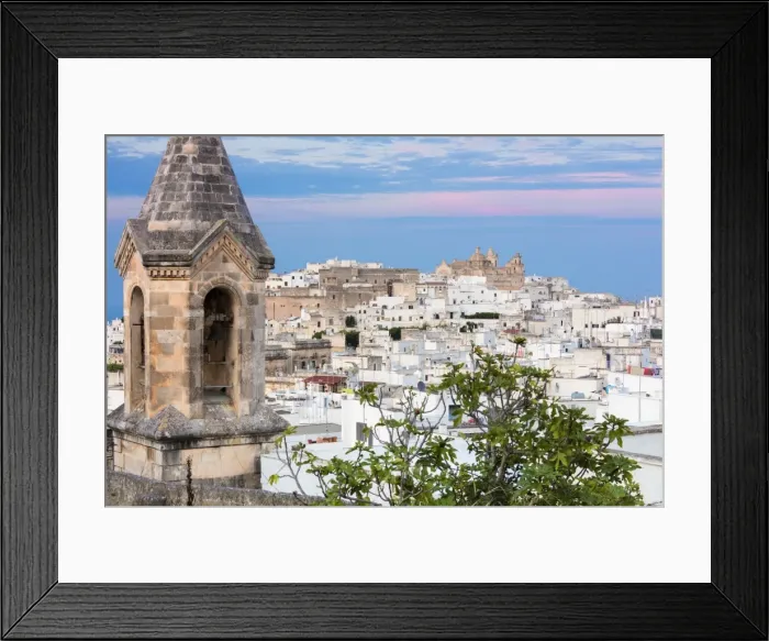 Framed Print : View of typical architecture and white houses of the old medieval town at sunset Framed Print : View of typical architecture and white houses of the old medieval town at sunset