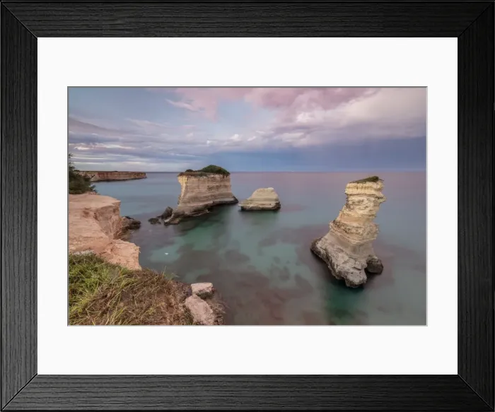 Framed Print : Pink sunset frames the cliffs known as Faraglioni di Sant Andrea and the turquoise sea Framed Print : Pink sunset frames the cliffs known as Faraglioni di Sant Andrea and the turquoise sea