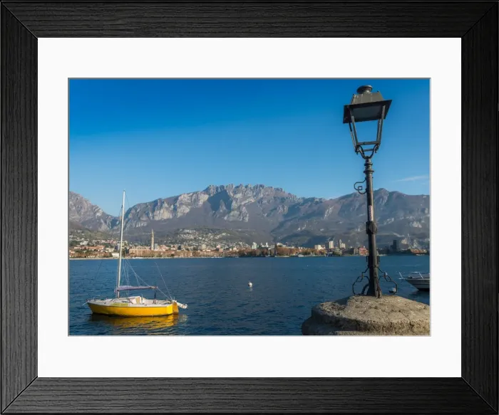 Framed Print : Lake of Lecco, a branch of Lake Como in the southern Alps with the city of Lecco in the background Framed Print : Lake of Lecco, a branch of Lake Como in the southern Alps with the city of Lecco in the background