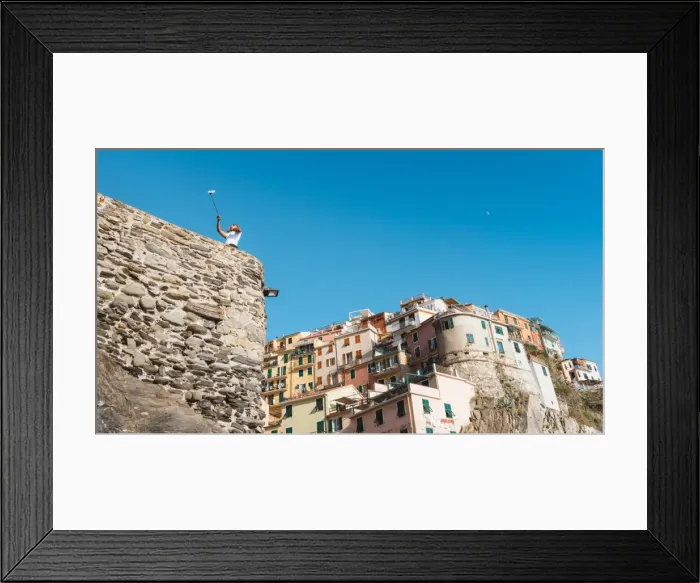 Framed Print : A man taking a selfie at Manarola, Cinque Terre, UNESCO World Heritage Site, Liguria Framed Print : A man taking a selfie at Manarola, Cinque Terre, UNESCO World Heritage Site, Liguria