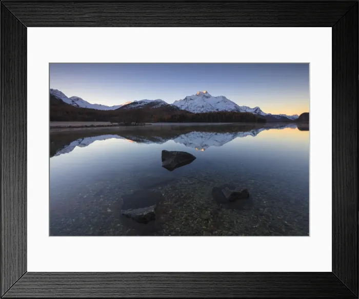 Framed Print : The snowy peaks are reflected in Lake Champfer at sunrise, St. Moritz, Canton of Graubunden