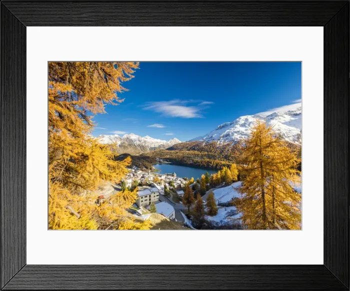 Framed Print : The alpine village of St. Moritz framed by colorful woods and the blue lake, Canton of Graubunden Framed Print : The alpine village of St. Moritz framed by colorful woods and the blue lake, Canton of Graubunden