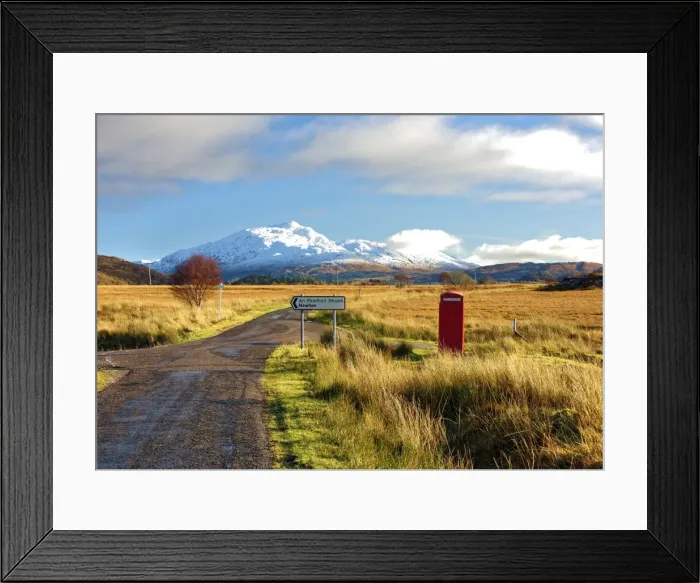 Framed Print : Winter view of a red telephone box and road toward snow covered Beinn Resipol mountain Framed Print : Winter view of a red telephone box and road toward snow covered Beinn Resipol mountain