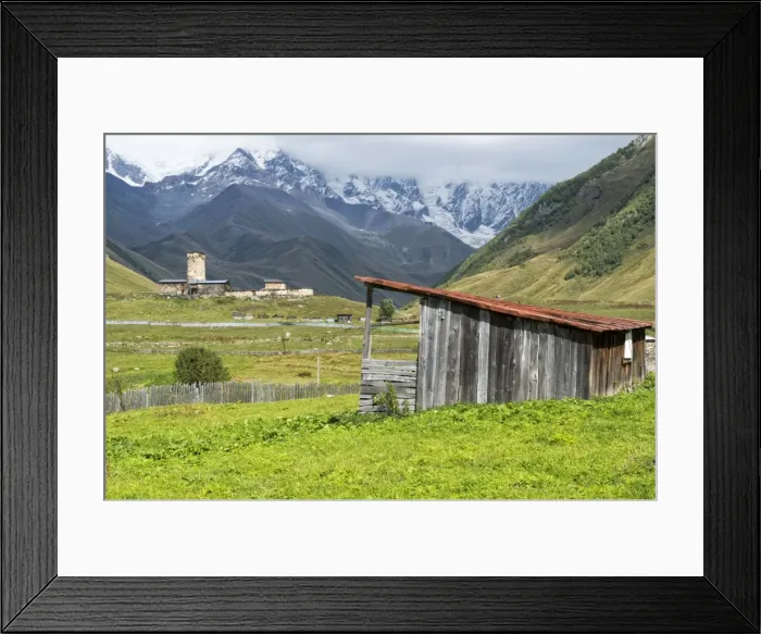 Framed Print : Traditional medieval Svanetian tower houses, Ushguli village, Shkhara Moutains behind Framed Print : Traditional medieval Svanetian tower houses, Ushguli village, Shkhara Moutains behind