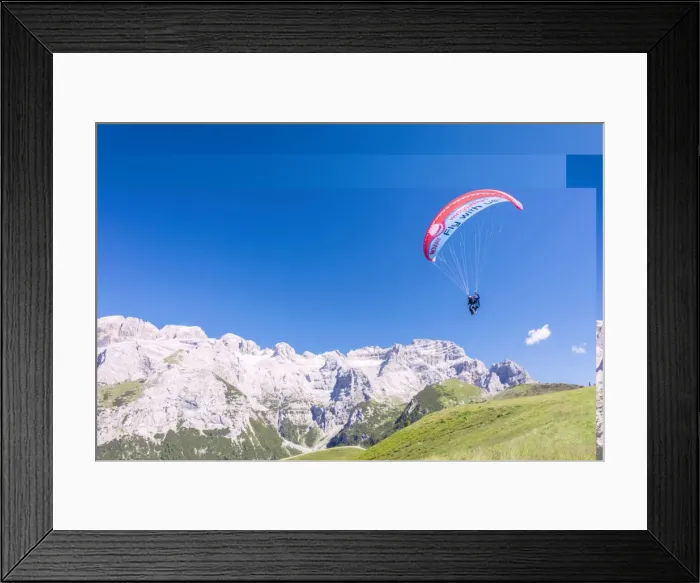 Framed Print : A paraglider among rocky peaks and green meadows Doss Del Sabion, Pinzolo, Brenta Dolomites Framed Print : A paraglider among rocky peaks and green meadows Doss Del Sabion, Pinzolo, Brenta Dolomites