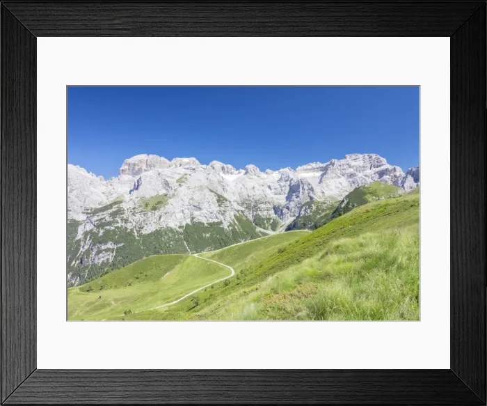 Framed Print : Green meadows frame the high rocky peaks, Doss Del Sabion, Pinzolo, Brenta Dolomites Framed Print : Green meadows frame the high rocky peaks, Doss Del Sabion, Pinzolo, Brenta Dolomites