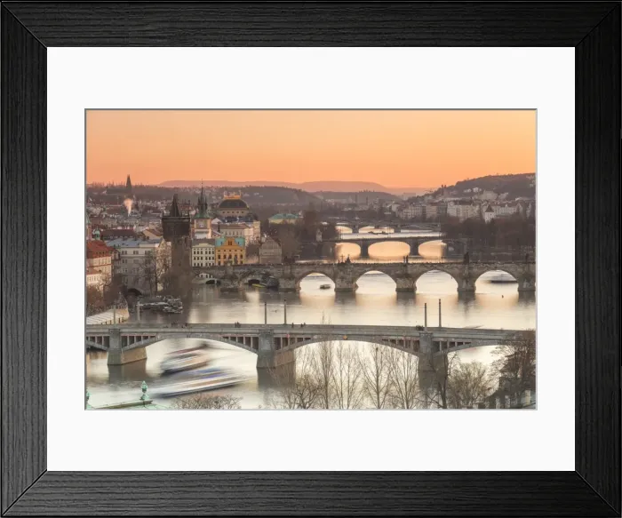 Framed Print : Orange sky at sunset on the historical bridges and buildings reflected on Vltava River Framed Print : Orange sky at sunset on the historical bridges and buildings reflected on Vltava River