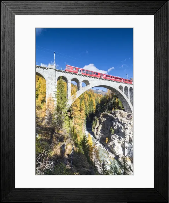 Framed Print : The red train on viaduct surrounded by colorful woods, Cinuos-Chel, Canton of Graubunden Framed Print : The red train on viaduct surrounded by colorful woods, Cinuos-Chel, Canton of Graubunden
