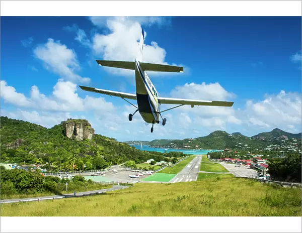 Small airplane landing at the airport of St. Barth (Saint Barthelemy), Lesser Antilles