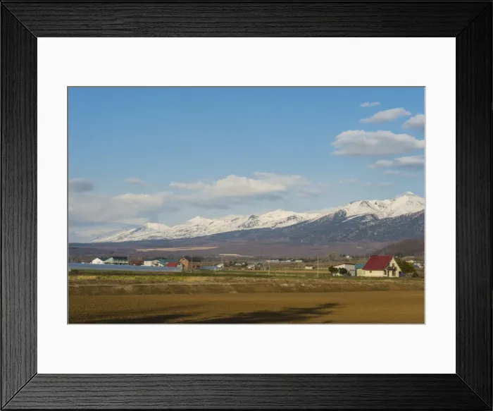 Framed Print : Farmland below the mountains of the Daisetsuzan National Park, UNESCO World Heritage Site Framed Print : Farmland below the mountains of the Daisetsuzan National Park, UNESCO World Heritage Site