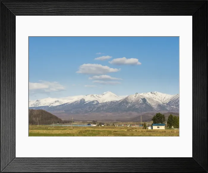 Framed Print : Farmland below the mountains of the Daisetsuzan National Park, UNESCO World Heritage Site Framed Print : Farmland below the mountains of the Daisetsuzan National Park, UNESCO World Heritage Site