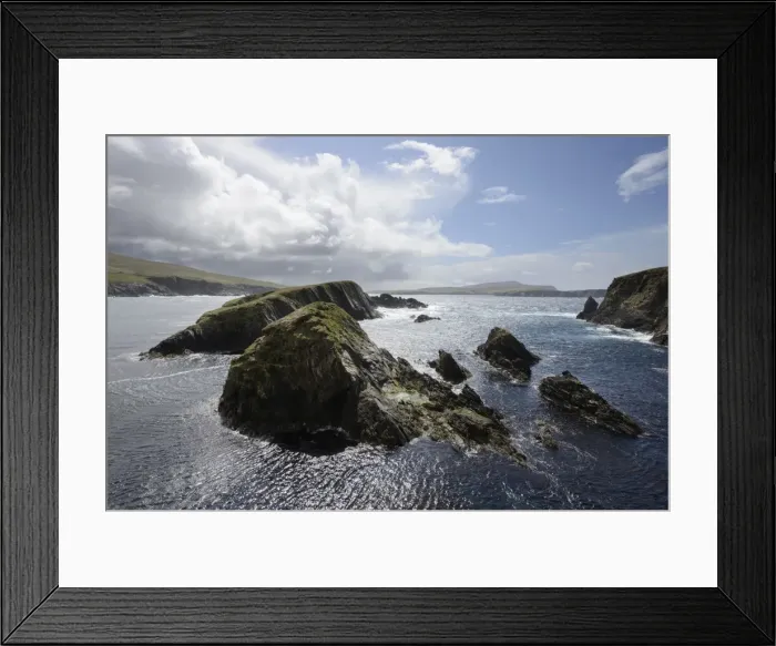 Framed Print : Huge clouds clear the way for bright sunshine to light the cliffs and islands of St Framed Print : Huge clouds clear the way for bright sunshine to light the cliffs and islands of St