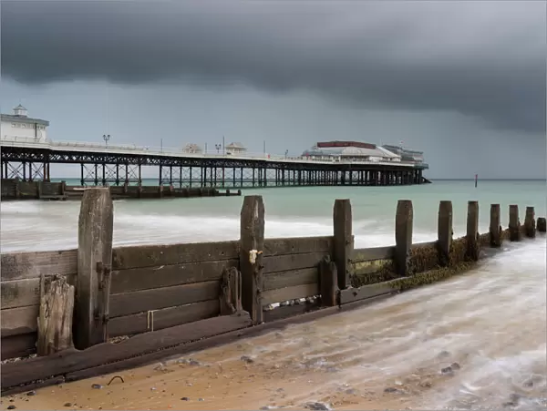 A stormy sky over the beach and pier at Cromer, Norfolk, England, United Kingdom, Europe