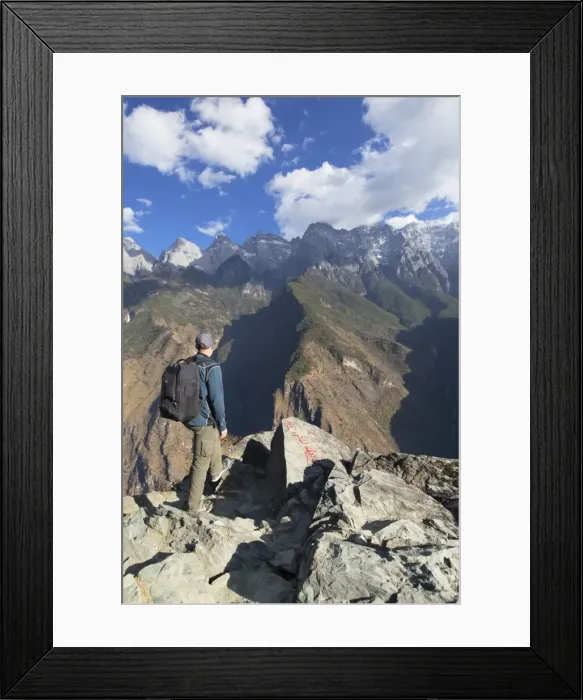 Framed Print : Man hiking in Tiger Leaping Gorge, UNESCO World Heritage Site, with Jade Dragon Snow Mountain Framed Print : Man hiking in Tiger Leaping Gorge, UNESCO World Heritage Site, with Jade Dragon Snow Mountain