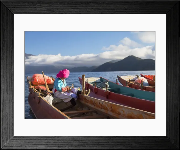 Framed Print : Mosu woman on boat, Luoshui, Lugu Lake, Yunnan, China, Asia Framed Print : Mosu woman on boat, Luoshui, Lugu Lake, Yunnan, China, Asia
