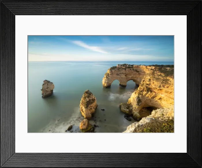 Framed Print : Sunrise on cliffs framed by turquoise water of the ocean, Praia da Marinha, Caramujeira Framed Print : Sunrise on cliffs framed by turquoise water of the ocean, Praia da Marinha, Caramujeira