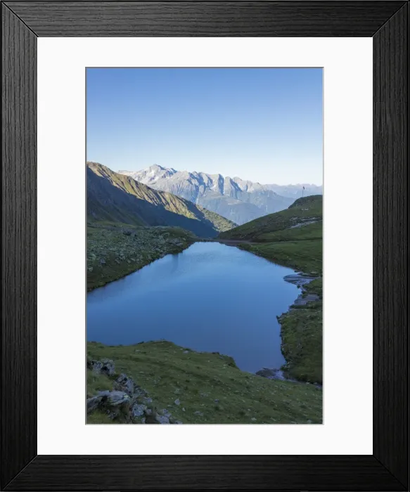 Framed Print : The alpine lake frames the green valley and Rifugio Bozzi, Val Di Viso, Camonica Valley Framed Print : The alpine lake frames the green valley and Rifugio Bozzi, Val Di Viso, Camonica Valley