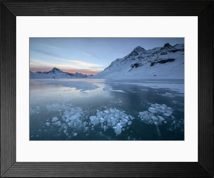 Framed Print : Ice bubbles frame the snowy peaks reflected in Lago Bianco, Bernina Pass, canton of Graubunden Framed Print : Ice bubbles frame the snowy peaks reflected in Lago Bianco, Bernina Pass, canton of Graubunden