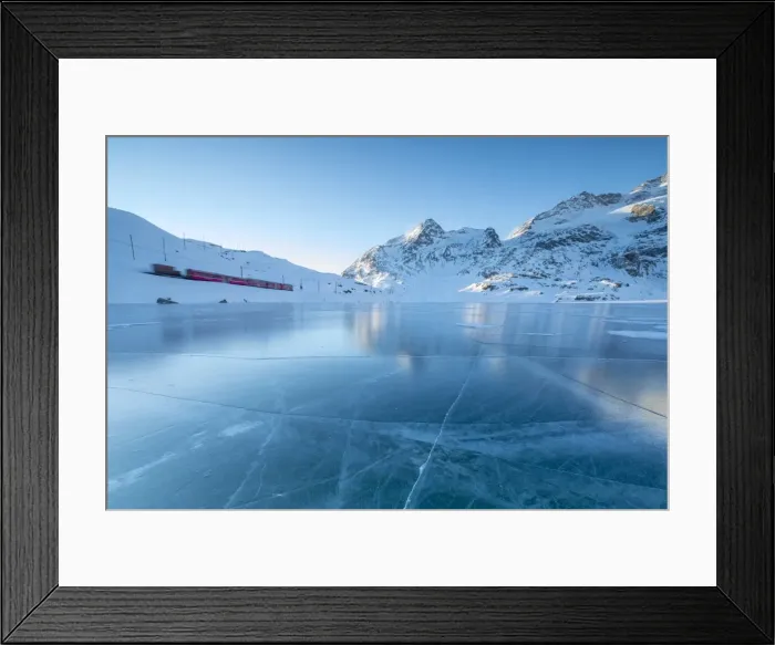 Framed Print : The Bernina Express train runs beside the frozen Lago Bianco, Bernina Pass, canton of Graubunden Framed Print : The Bernina Express train runs beside the frozen Lago Bianco, Bernina Pass, canton of Graubunden