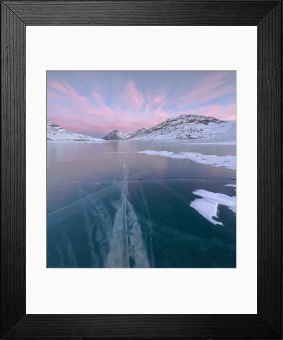 Framed Print : Panorama of the frozen Lago Bianco framed by pink clouds at dawn, Bernina Pass, canton Framed Print : Panorama of the frozen Lago Bianco framed by pink clouds at dawn, Bernina Pass, canton