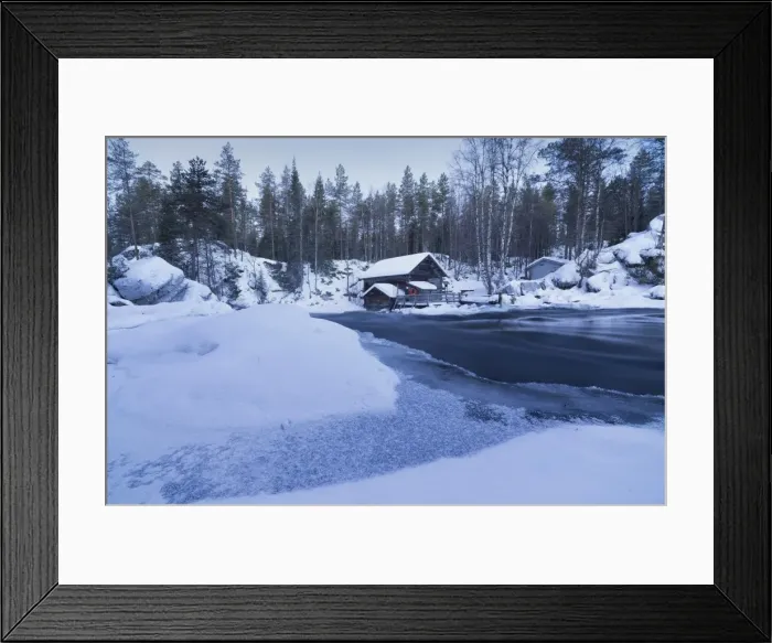 Framed Print : Dusk frames the frozen water in the snowy woods and a wooden hut, Juuma, Myllykoski Framed Print : Dusk frames the frozen water in the snowy woods and a wooden hut, Juuma, Myllykoski