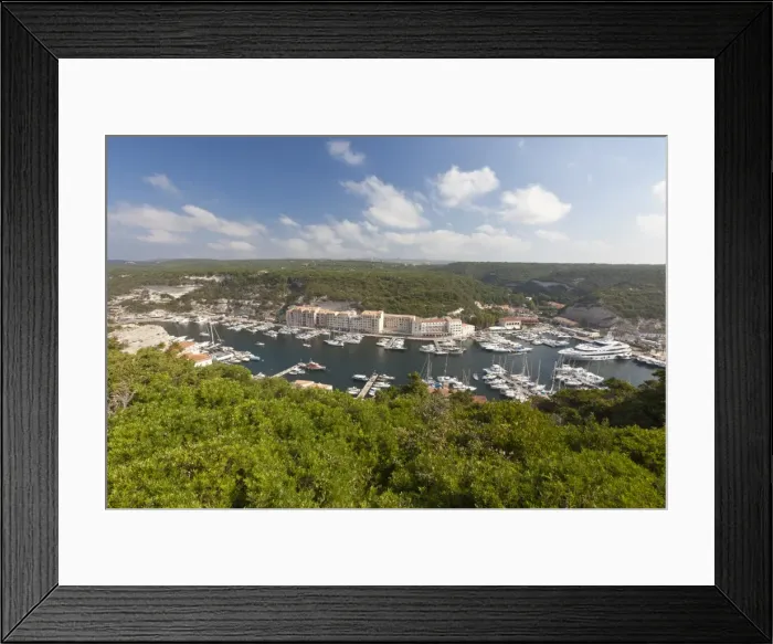 Framed Print : Green vegetation frames the medieval town and harbour, Bonifacio, Corsica, France Framed Print : Green vegetation frames the medieval town and harbour, Bonifacio, Corsica, France