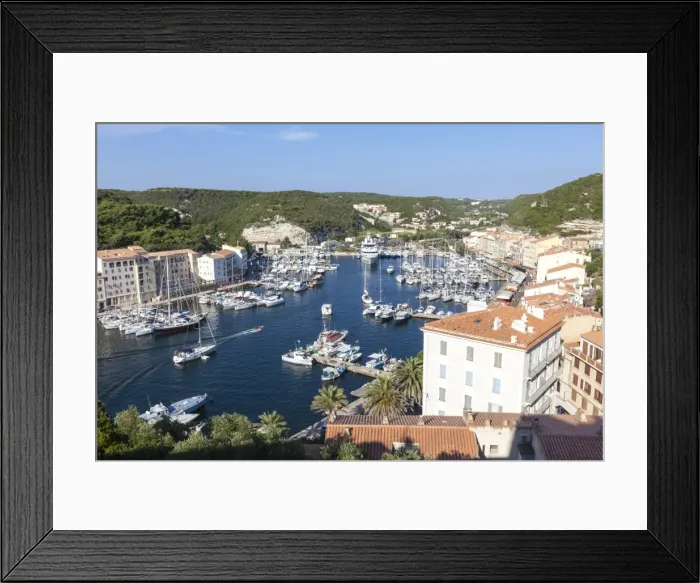 Framed Print : The green vegetation frames the medieval town and harbour, Bonifacio, Corsica, France Framed Print : The green vegetation frames the medieval town and harbour, Bonifacio, Corsica, France