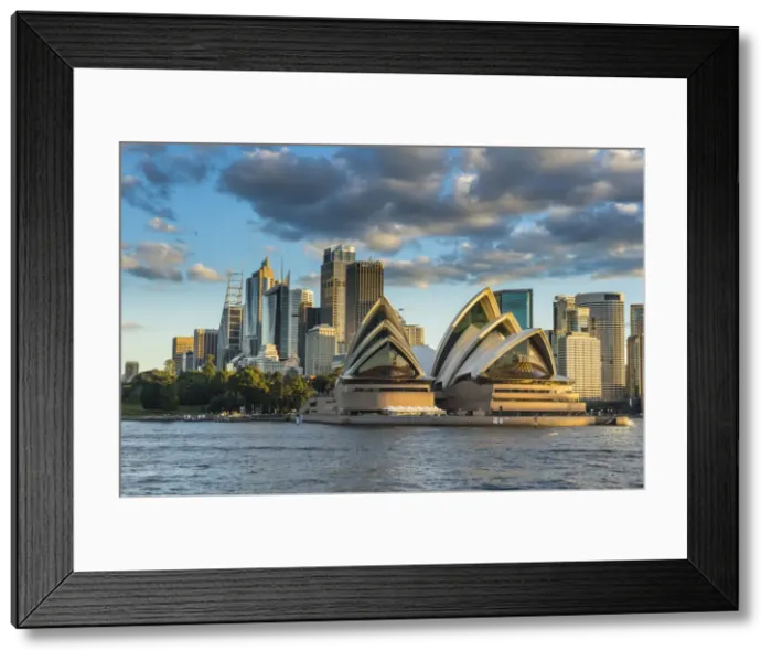 Framed Print : The Sydney Opera House, UNESCO World Heritage Site, and skyline of Sydney at sunset Framed Print : The Sydney Opera House, UNESCO World Heritage Site, and skyline of Sydney at sunset