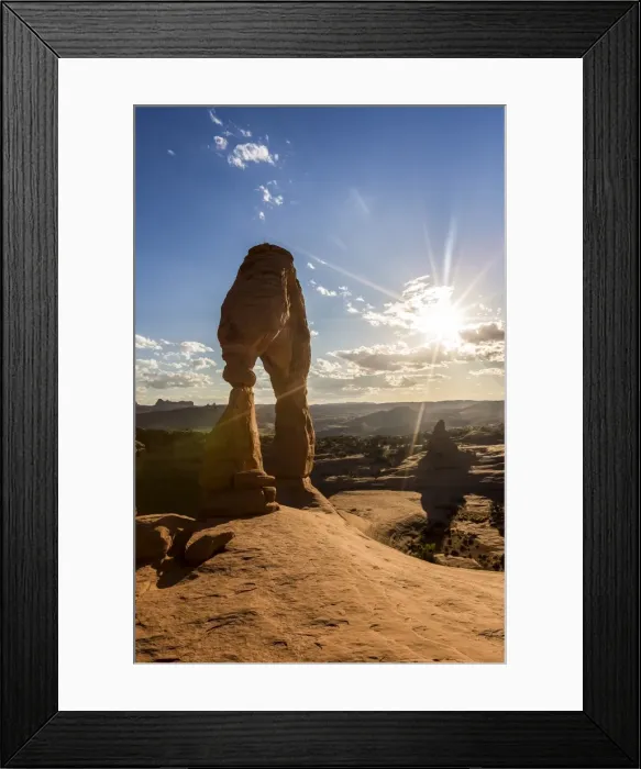 Framed Print : Delicate Arch with sun and clouds at golden hour, Arches National Park, Moab, Grand County Framed Print : Delicate Arch with sun and clouds at golden hour, Arches National Park, Moab, Grand County