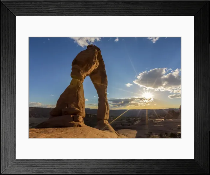 Framed Print : Delicate Arch with sun and clouds at golden hour, Arches National Park, Moab, Grand County Framed Print : Delicate Arch with sun and clouds at golden hour, Arches National Park, Moab, Grand County