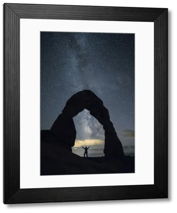 Framed Print : Milky Way and person under Delicate Arch, Arches National Park, Moab, Grand County Framed Print : Milky Way and person under Delicate Arch, Arches National Park, Moab, Grand County