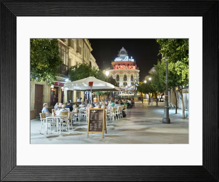 Framed Print : Night view of cafes along Calle Lanceria and El Gallo Azul rotunda building, Jerez de la Frontera Framed Print : Night view of cafes along Calle Lanceria and El Gallo Azul rotunda building, Jerez de la Frontera