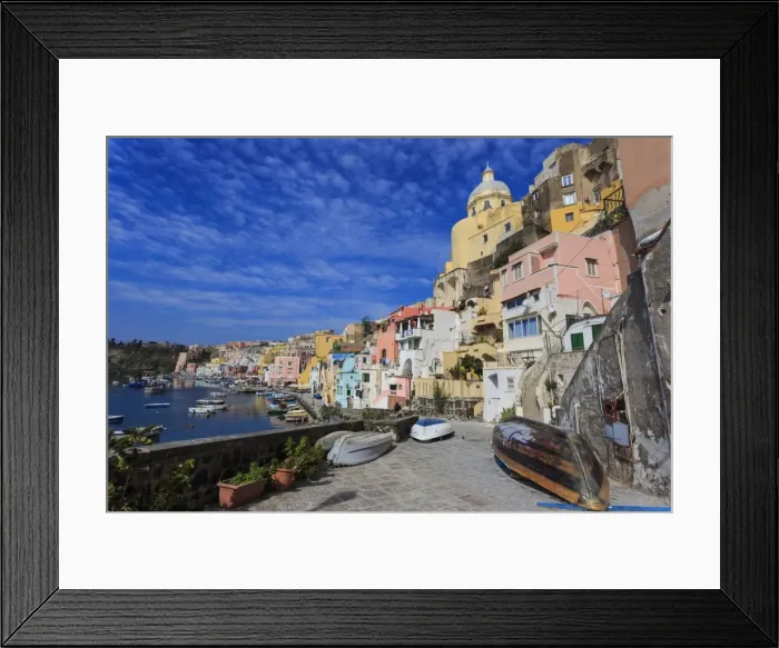 Framed Print : Marina Corricella, pretty fishing village, colourful fishermens houses, boats and church Framed Print : Marina Corricella, pretty fishing village, colourful fishermens houses, boats and church