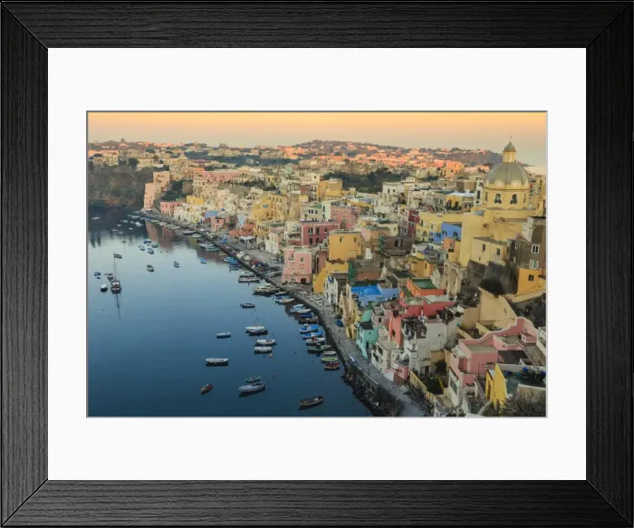 Framed Print : Marina Corricella at sunrise, fishing village, colourful houses, church and harbour boats Framed Print : Marina Corricella at sunrise, fishing village, colourful houses, church and harbour boats