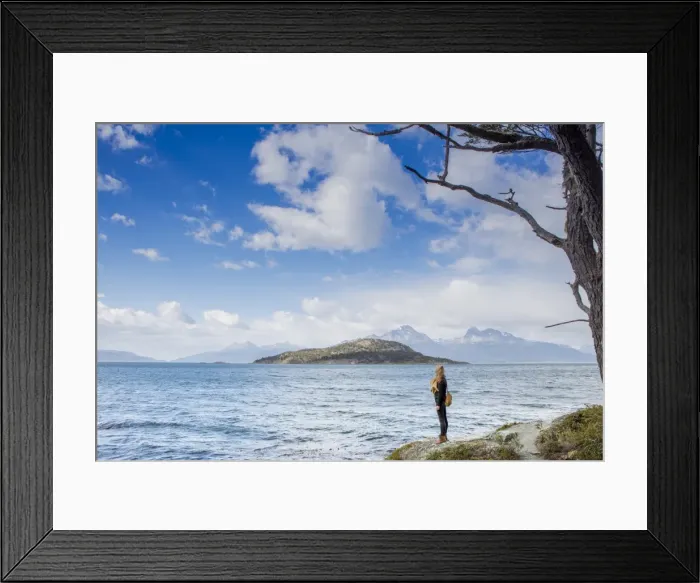 Framed Print : Woman looking out over the Magellan Straits and Darwin Mountain range in Tierra del Framed Print : Woman looking out over the Magellan Straits and Darwin Mountain range in Tierra del