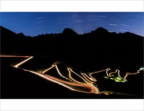 Star trail on the lights of car trace at Stelvio Pass, Valtellina, Lombardy, Trentino Alto Adige