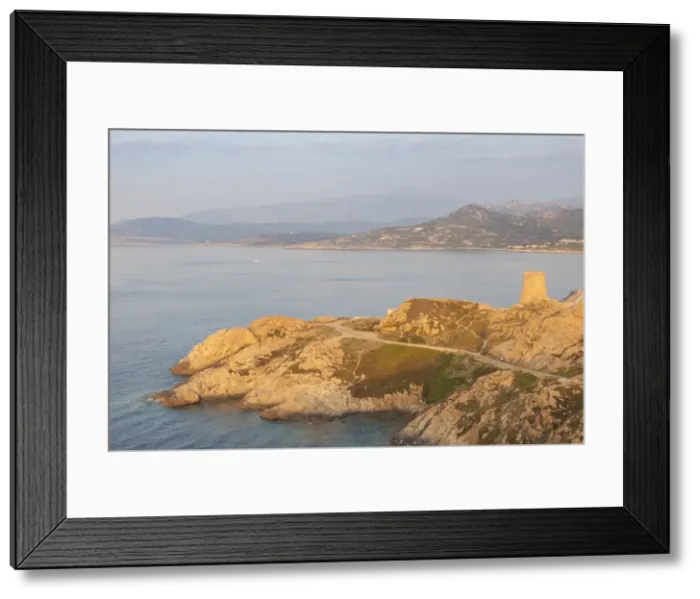 Framed Print : The ancient Genoese tower overlooking the blue sea surrounding the village of Ile Rousse Framed Print : The ancient Genoese tower overlooking the blue sea surrounding the village of Ile Rousse