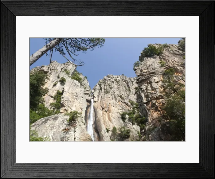 Framed Print : Blue sky frames The Piscia di Gallo waterfall surrounded by granite rocks, Zonza Framed Print : Blue sky frames The Piscia di Gallo waterfall surrounded by granite rocks, Zonza