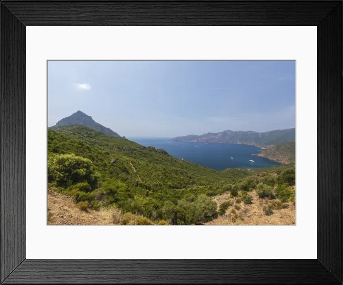 Framed Print : Top view of turquoise sea and bay framed by green vegetation on the promontory, Porto Framed Print : Top view of turquoise sea and bay framed by green vegetation on the promontory, Porto