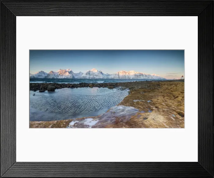Framed Print : Panorama of frozen sea and snowy peaks at dawn surrounded by rocks covered with ice Framed Print : Panorama of frozen sea and snowy peaks at dawn surrounded by rocks covered with ice