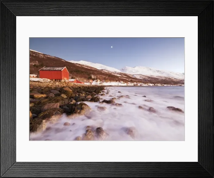 Framed Print : Waves of cold sea crashing on the rocks and typical wooden huts called Rorbu, Djupvik Framed Print : Waves of cold sea crashing on the rocks and typical wooden huts called Rorbu, Djupvik