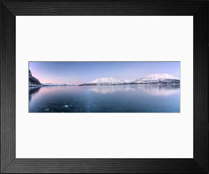 Framed Print : Panorama of pink sky and snowy peaks reflected in the frozen sea at sunset, Manndalen Framed Print : Panorama of pink sky and snowy peaks reflected in the frozen sea at sunset, Manndalen