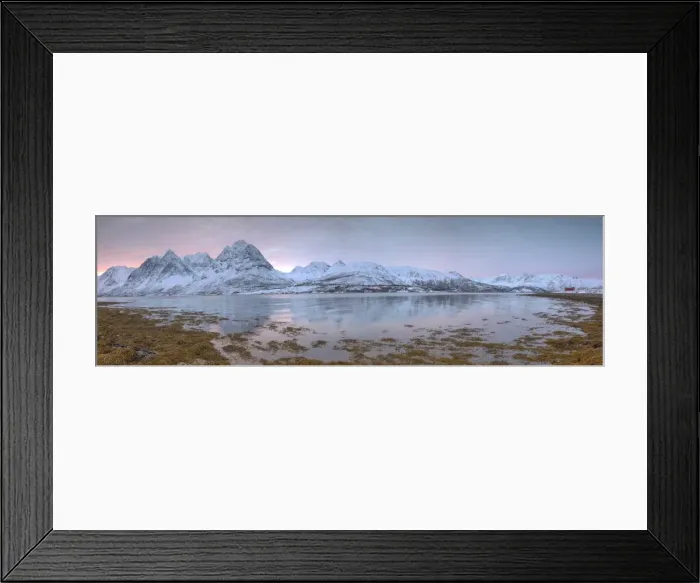Framed Print : Panorama of pink sky at dawn on snowy fields and wooden hut surrounded by frozen sea Framed Print : Panorama of pink sky at dawn on snowy fields and wooden hut surrounded by frozen sea