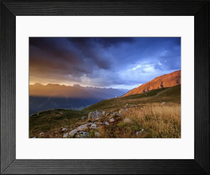 Framed Print : Fiery sky and dark clouds on high peaks of Muottas Muragl at sunset, St Framed Print : Fiery sky and dark clouds on high peaks of Muottas Muragl at sunset, St