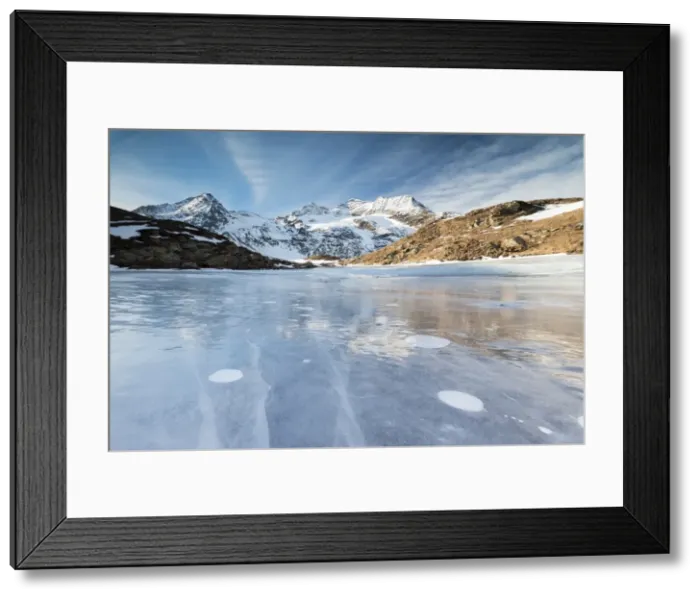Framed Print : Blue sky on the frozen Lej Nair surrounded by snowy peaks, Bernina Pass, Canton of Graubunden Framed Print : Blue sky on the frozen Lej Nair surrounded by snowy peaks, Bernina Pass, Canton of Graubunden