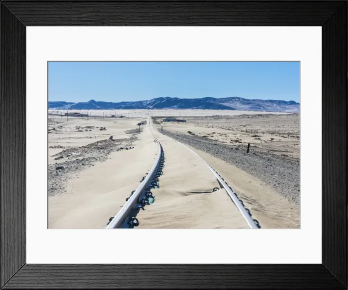 Framed Print : Railway tracks overflown by sand, old diamond ghost town, Kolmanskop, near Luderitz Framed Print : Railway tracks overflown by sand, old diamond ghost town, Kolmanskop, near Luderitz